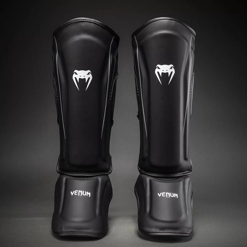 Espinilleras Venum Streamline – Negro/Blanco